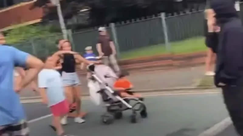 Nevey Smith baby in pram joins riot